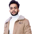 A man with dark hair and a trimmed beard is wearing a beige jacket over a white turtleneck. He is posed against a plain white background.